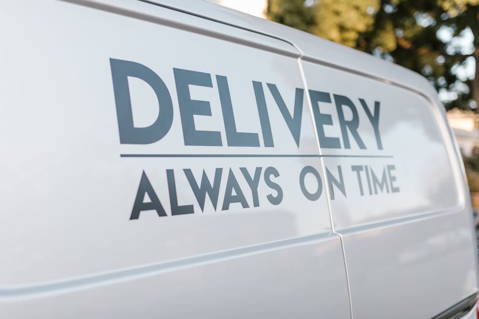 DELIVERY ALWAYS ON TIME' text on the side of a white van.