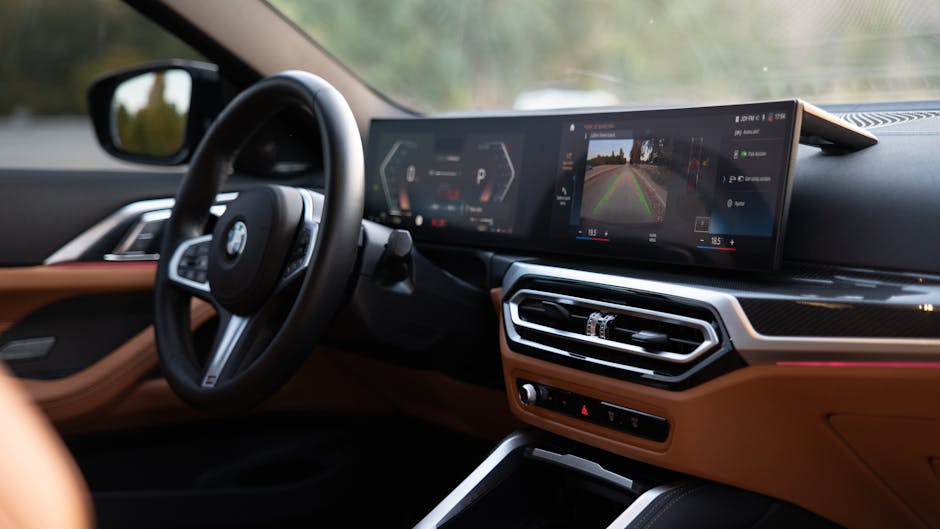 Modern vehicle dashboard with a large digital screen displaying telematics-related information - making a difference with van insurance policies