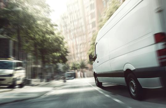 A white cargo van from a business who relies on dependable van insurance.