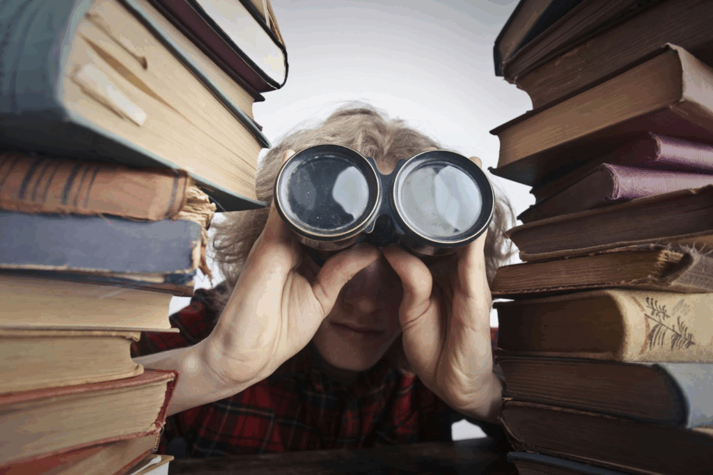 A person with binoculars looking for information to improve their risk profile.