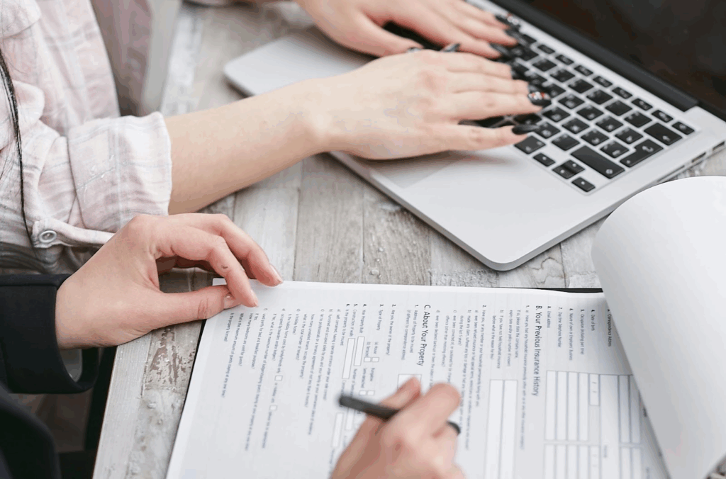 A business owner applying for coverage, while using a business insurance calculator.