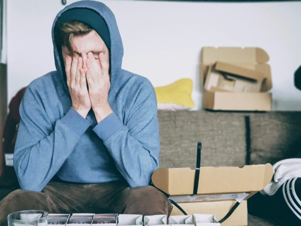 A person stressed about home insurance, struggling to find the best coverage. .