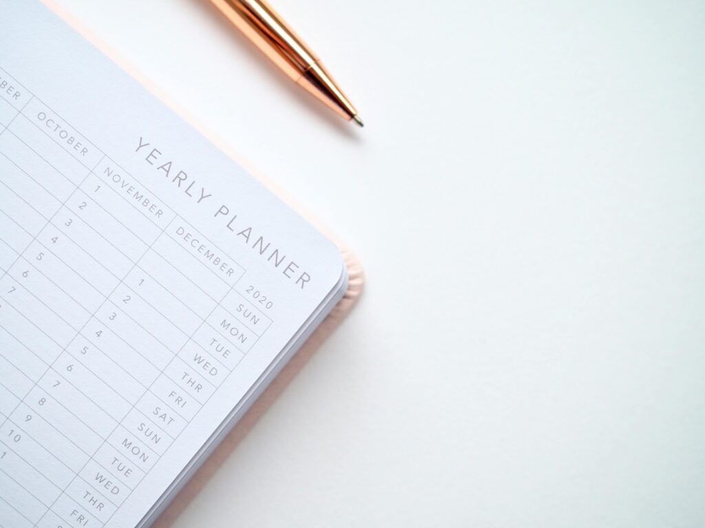 A yearly planner representing a person looking for the best time to apply for a surety bond.