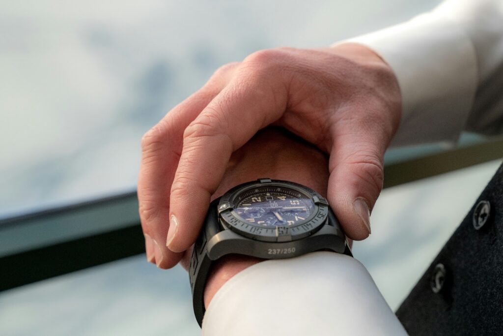 A person checking their watch, representing how timing is important in motorcycle insurance quotes.