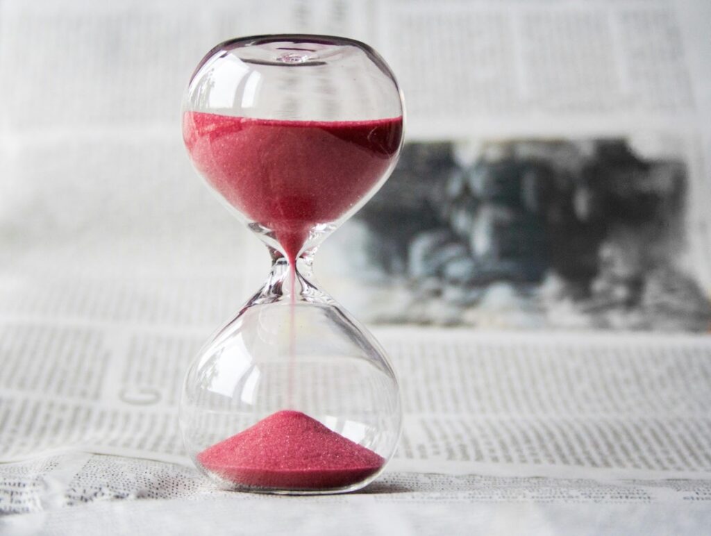 An hourglass, representing the importance of timing when applying for accident insurance.